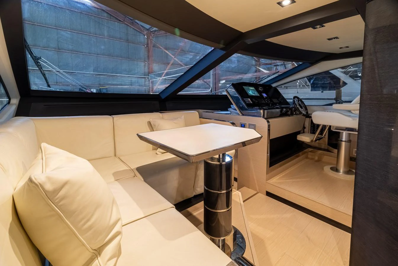 The helm area features a sleek design with comfortable seating and advanced navigation equipment. aboard SABI Yacht for Sale