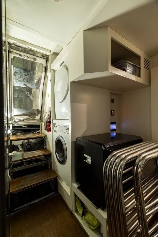 The yacht's laundry room is equipped with modern appliances and ample storage space. aboard SABI Yacht for Sale