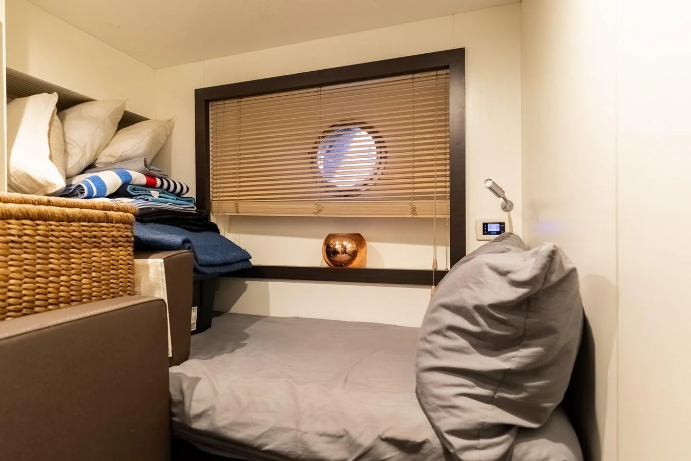 a room with a bed and a television aboard SABI Yacht for Sale