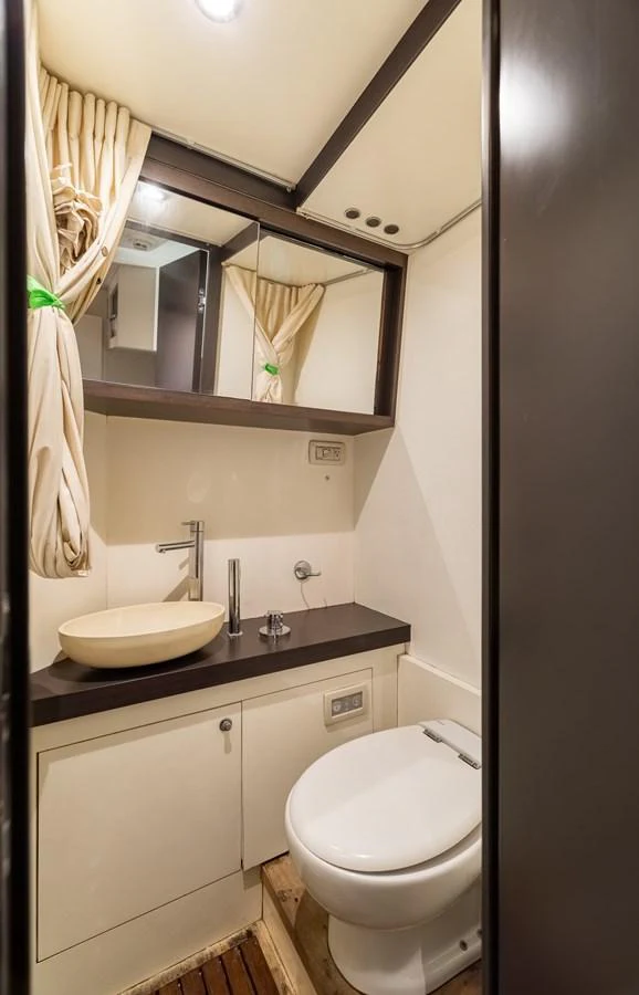 a bathroom with a sink and a toilet aboard SABI Yacht for Sale