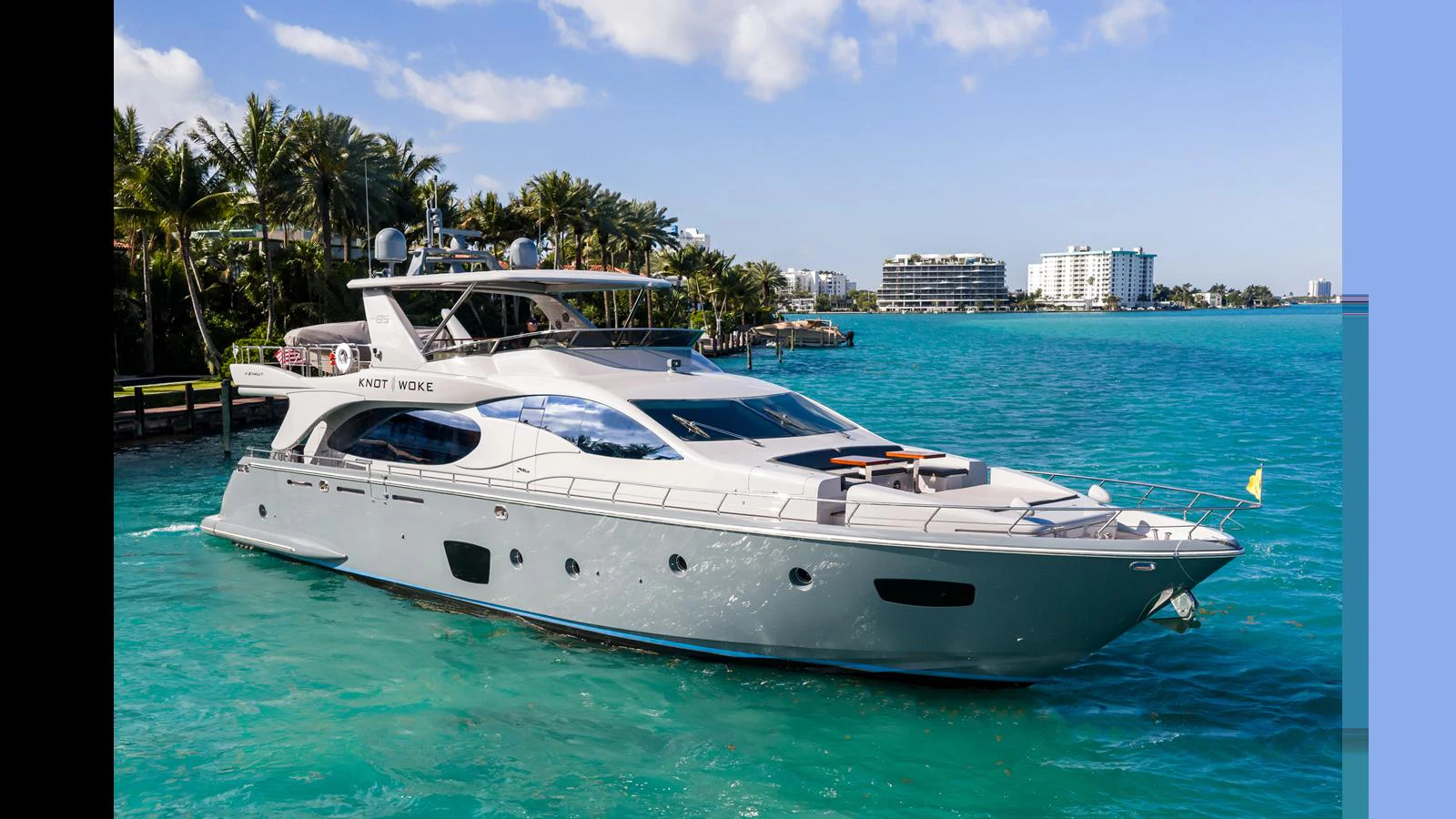 a white yacht in the water aboard KNOT WOKE Yacht for Sale