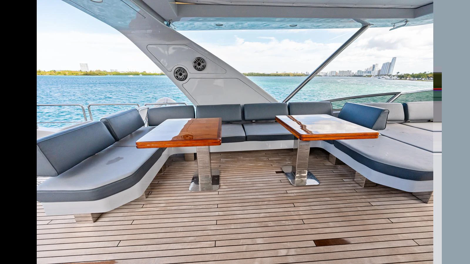 a deck with a view of the water and boats aboard KNOT WOKE Yacht for Sale