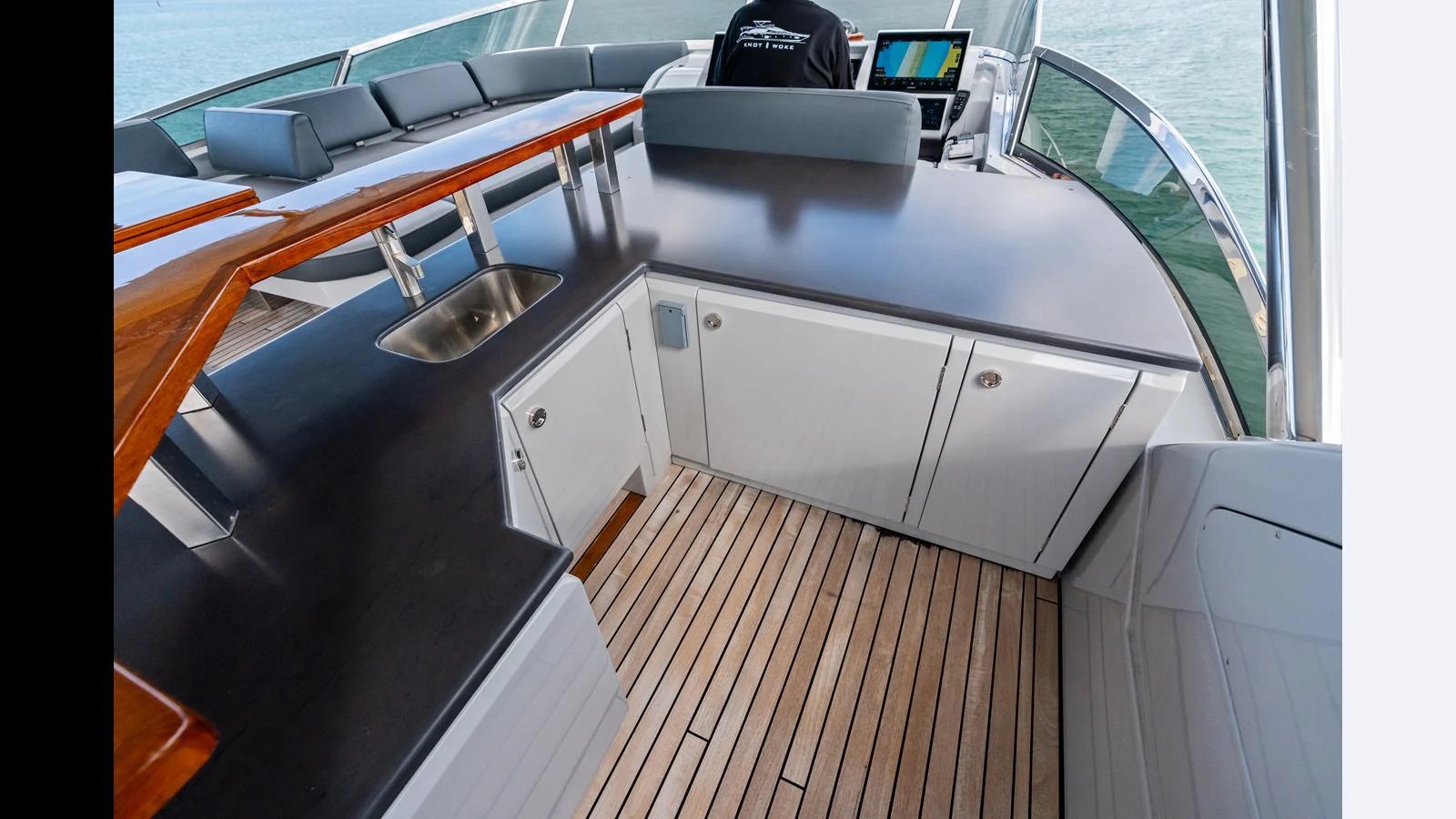 a kitchen with a sink and a microwave aboard KNOT WOKE Yacht for Sale