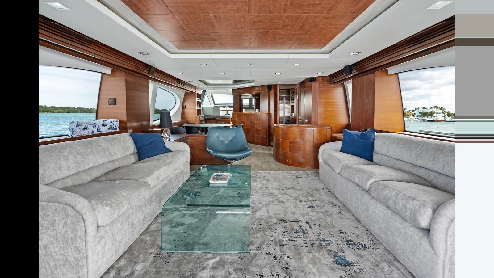 a living room with couches and a table aboard KNOT WOKE Yacht for Sale