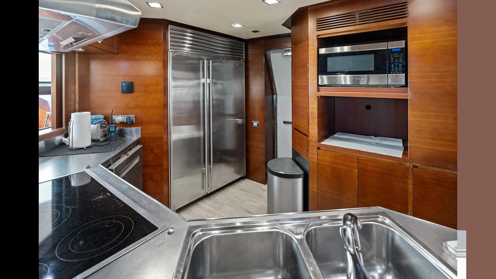 a kitchen with stainless steel appliances aboard KNOT WOKE Yacht for Sale