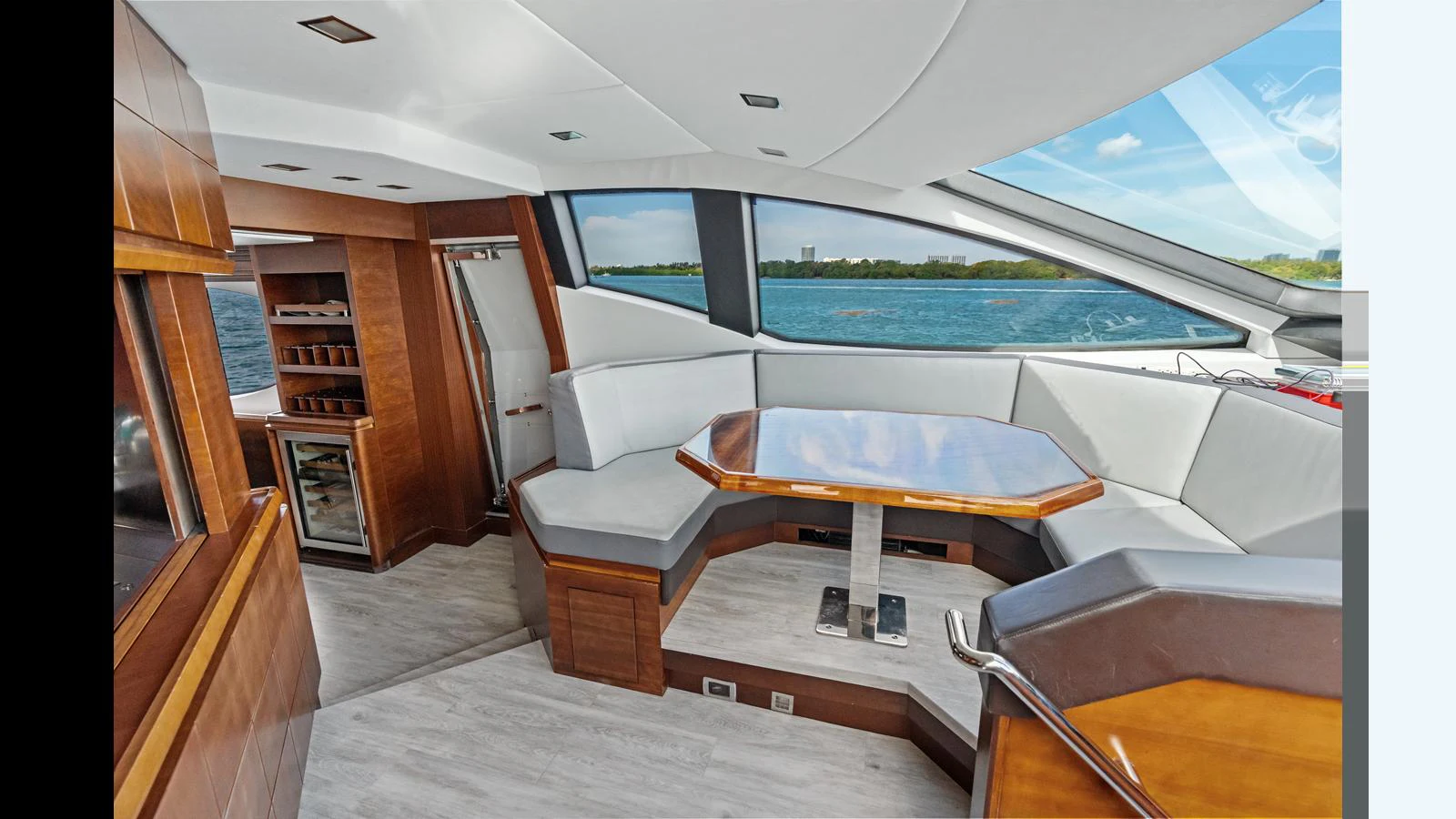 a room with a pool table and chairs aboard KNOT WOKE Yacht for Sale