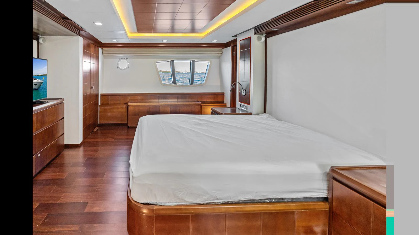 a bedroom with a bed and a desk aboard KNOT WOKE Yacht for Sale