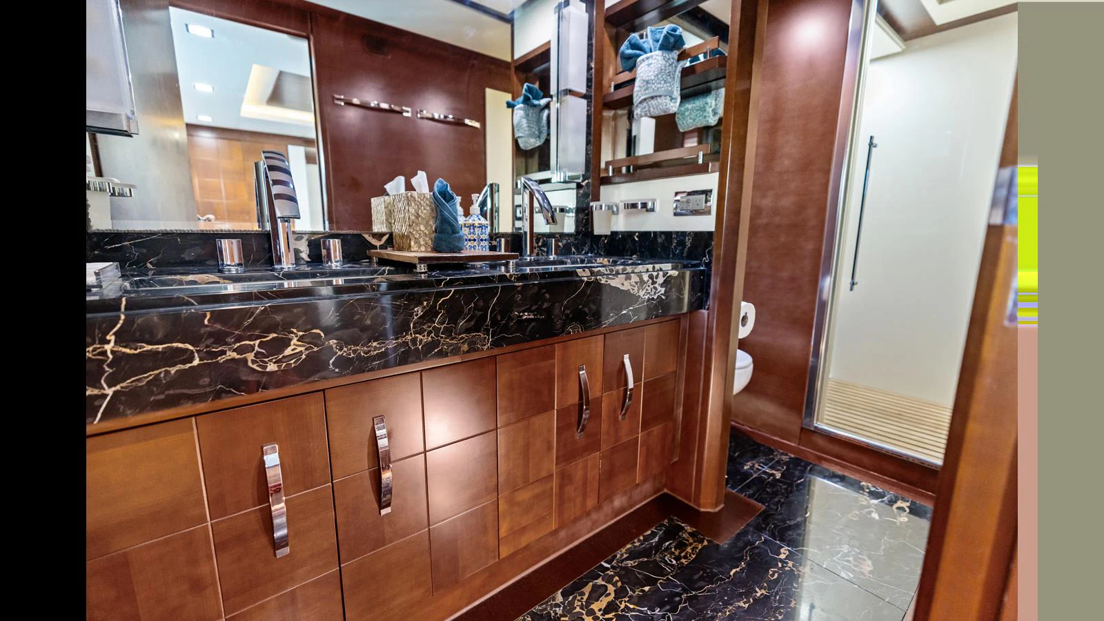 a kitchen with a black counter top aboard KNOT WOKE Yacht for Sale