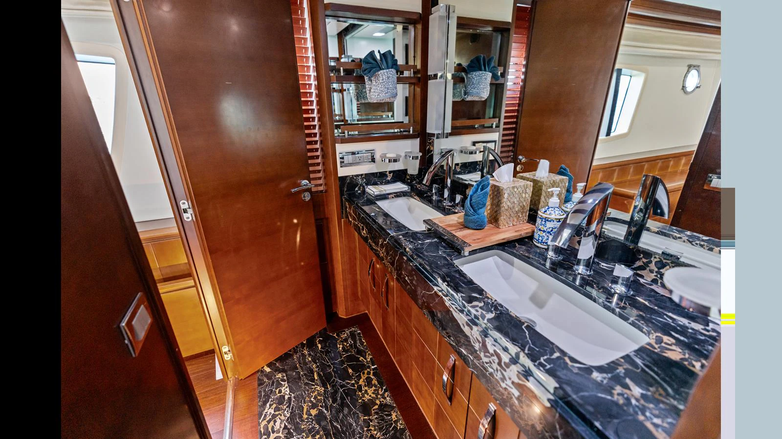 a bathroom with a sink and a mirror aboard KNOT WOKE Yacht for Sale