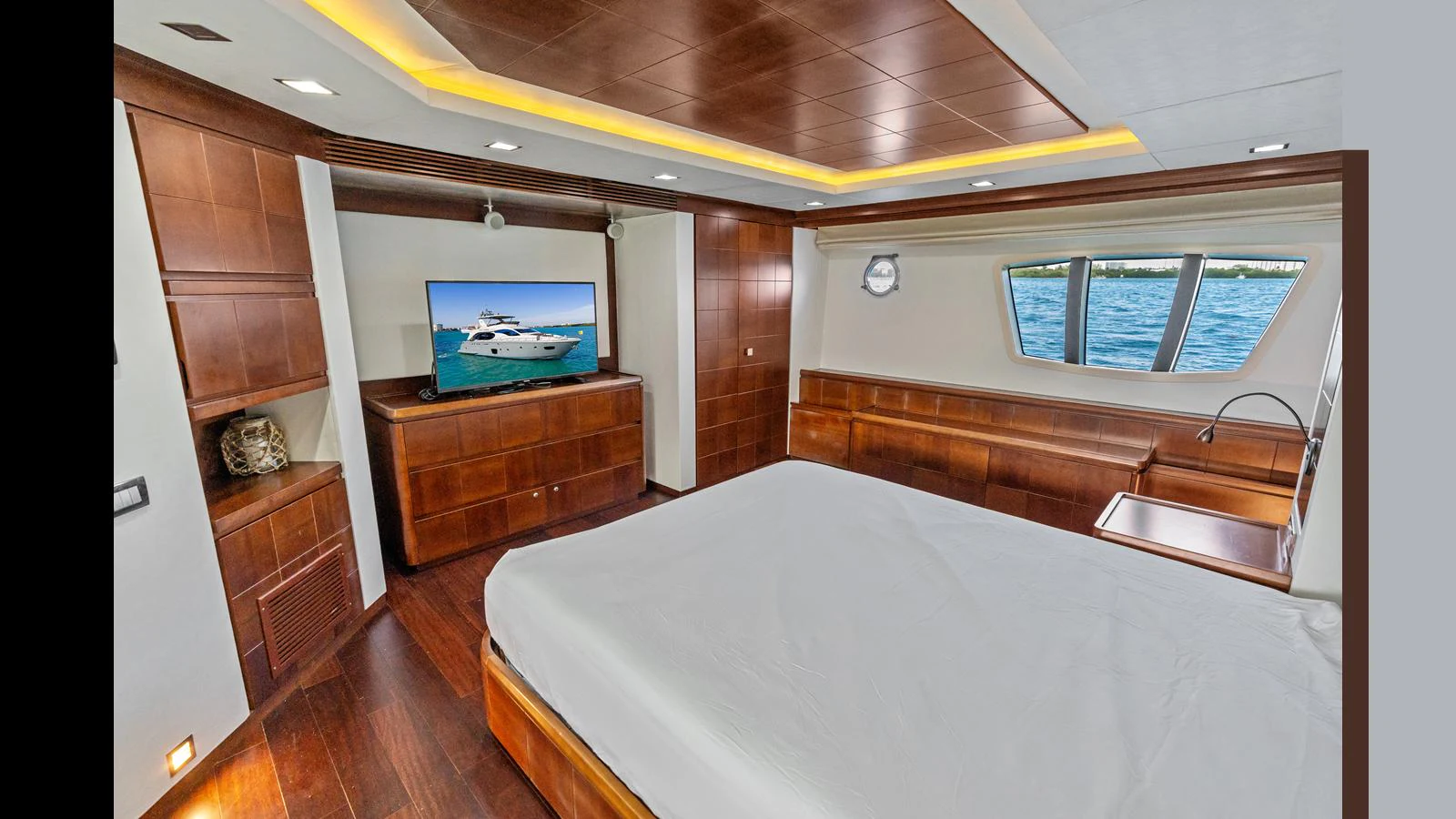 a bedroom with a bed and a tv aboard KNOT WOKE Yacht for Sale