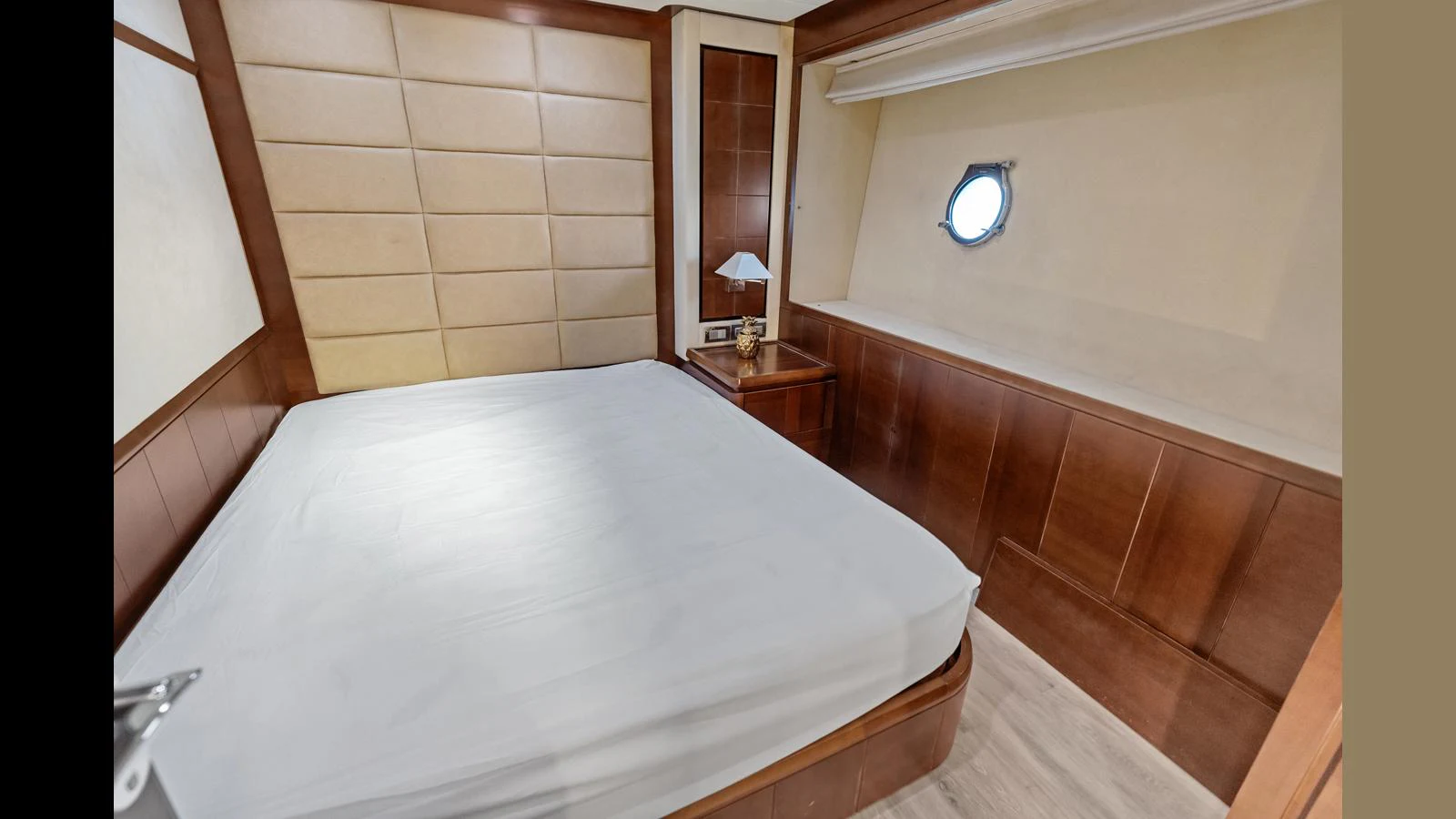 a bed with a white sheet aboard KNOT WOKE Yacht for Sale