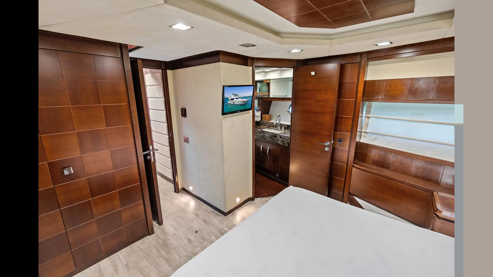 a large kitchen with a large white table and a large window aboard KNOT WOKE Yacht for Sale