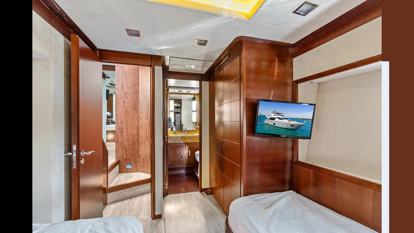 a room with a bed and a television aboard KNOT WOKE Yacht for Sale