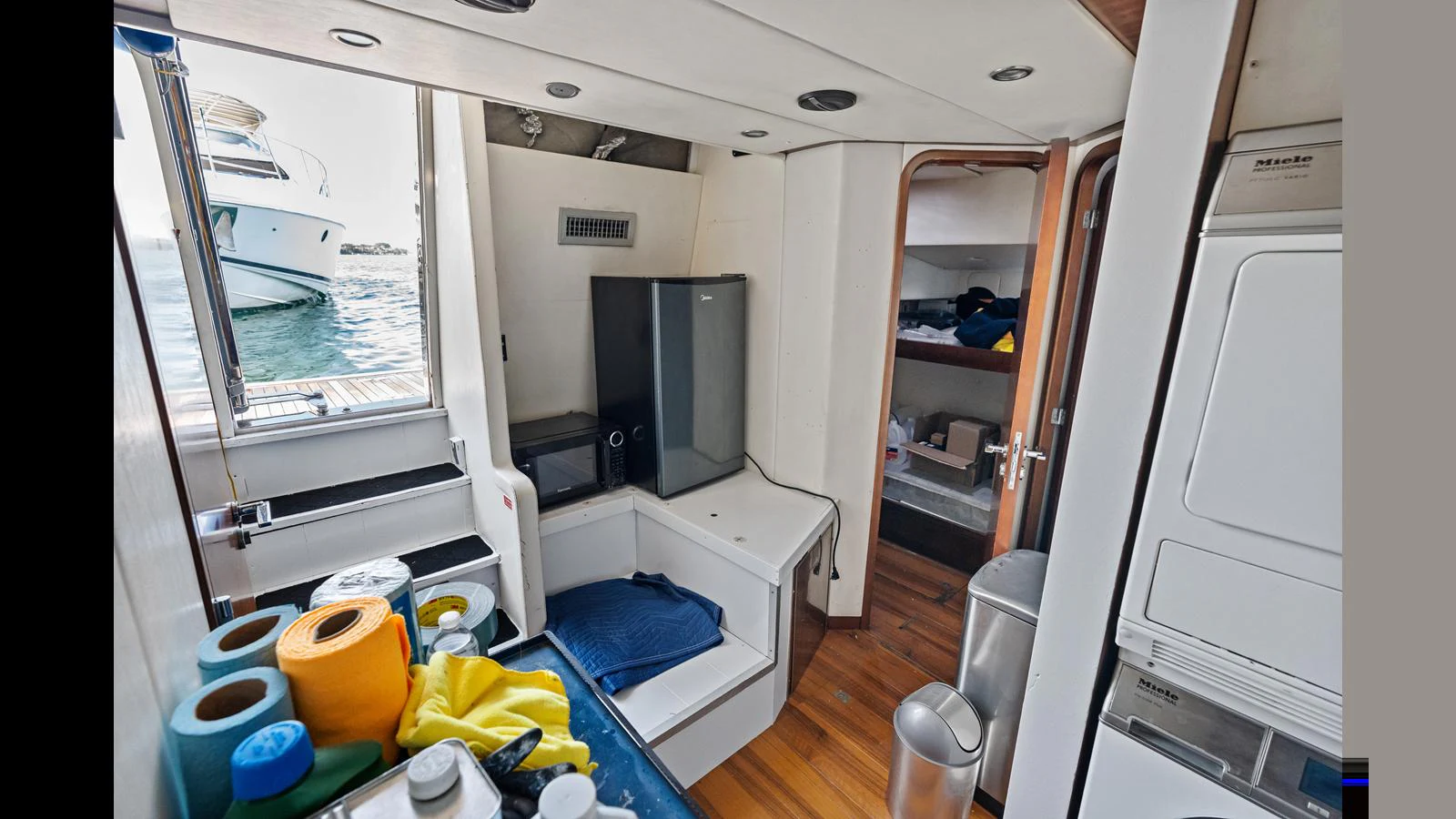 a room with a window and a television aboard KNOT WOKE Yacht for Sale