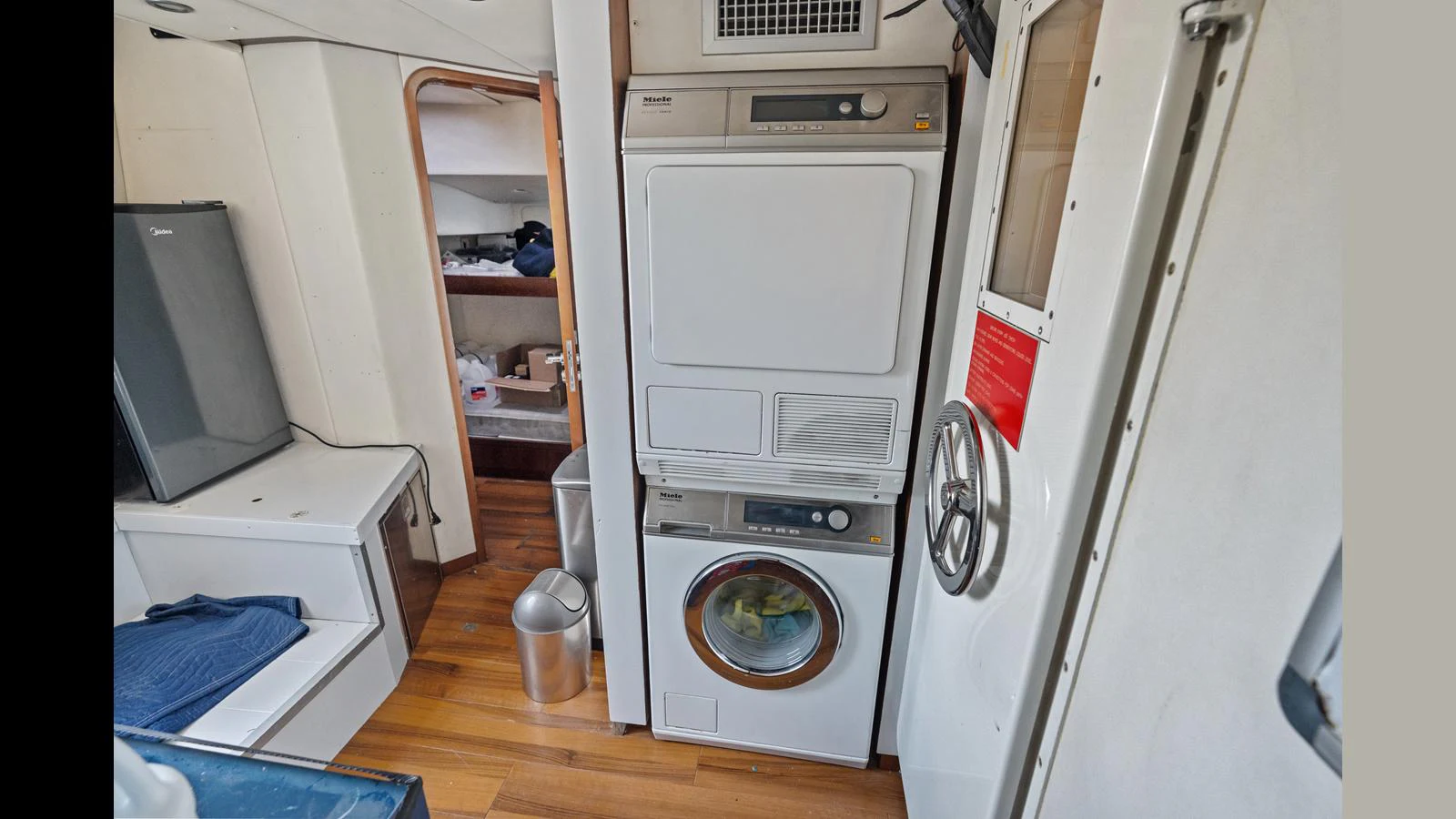 a white washing machine aboard KNOT WOKE Yacht for Sale