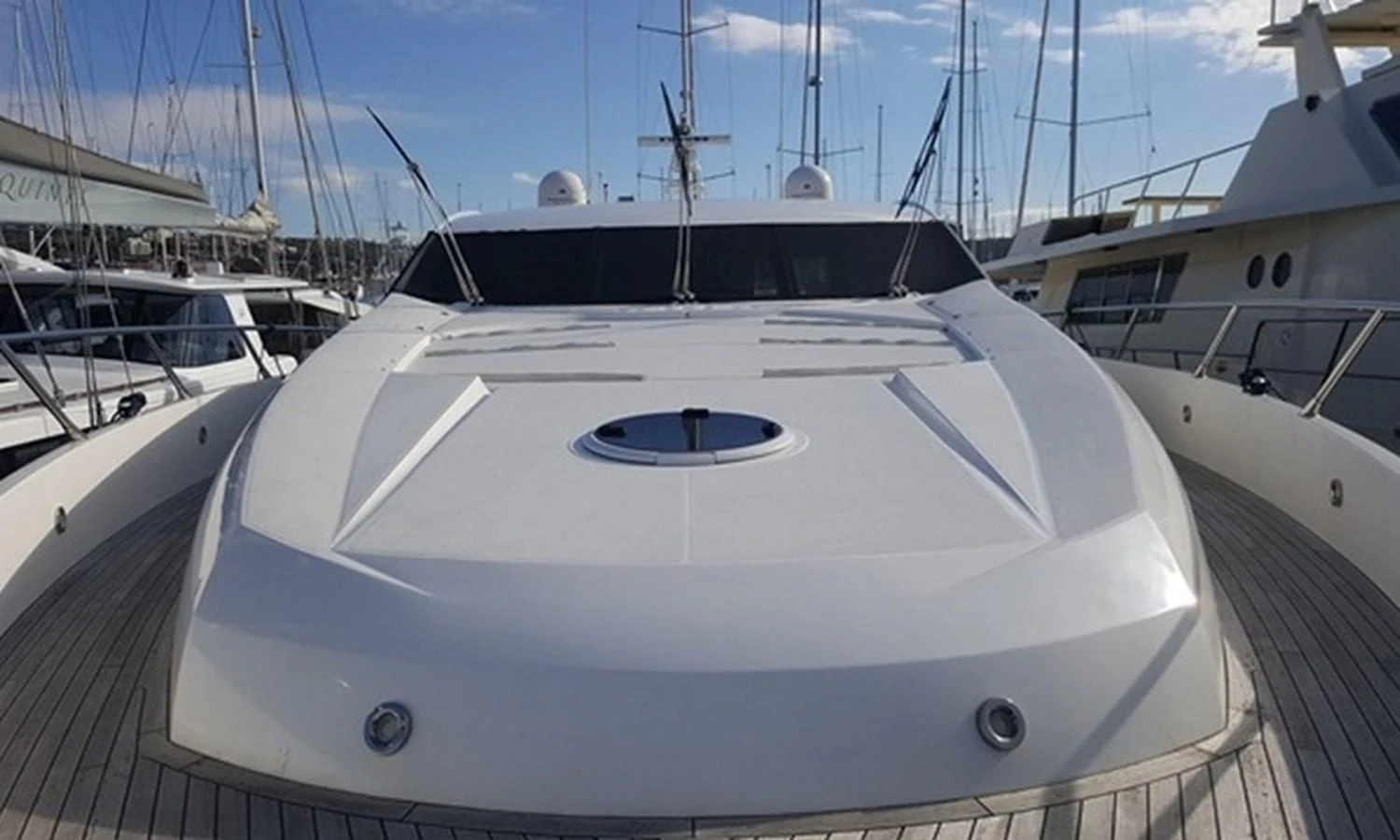 a white yacht on a dock aboard ESY Yacht for Sale
