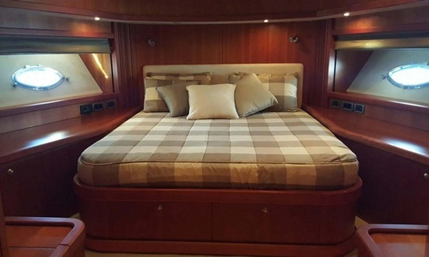 a bed with a red cover aboard ESY Yacht for Sale