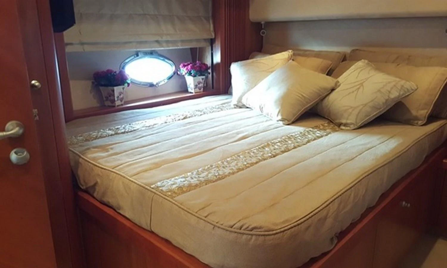 a bed with white sheets aboard ESY Yacht for Sale