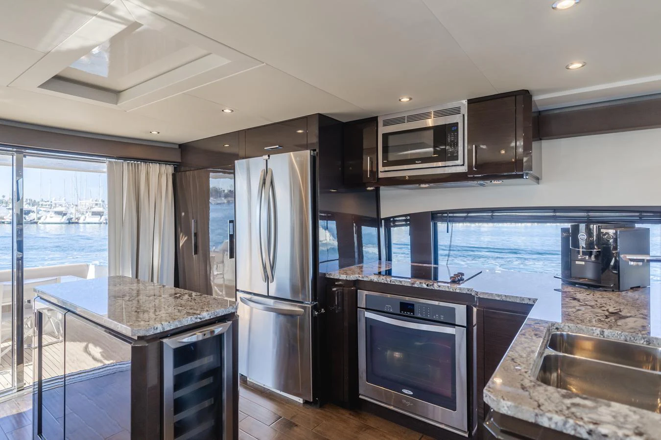 a kitchen with a large glass window aboard FINE SEAS-ONINGS Yacht for Sale