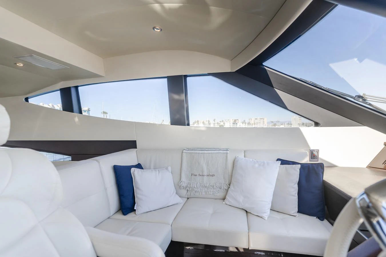 a white couch with pillows aboard FINE SEAS-ONINGS Yacht for Sale