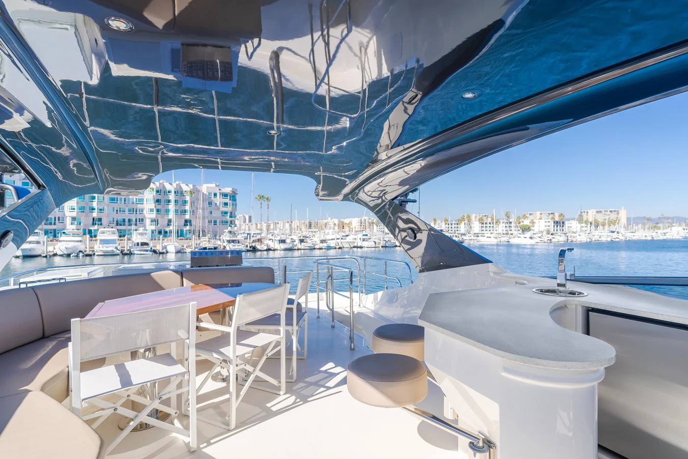 a room with a view of a city and a large body of water aboard FINE SEAS-ONINGS Yacht for Sale