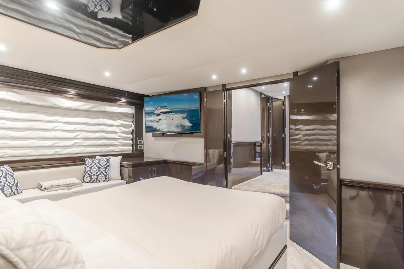 a bedroom with a bed and a television aboard FINE SEAS-ONINGS Yacht for Sale