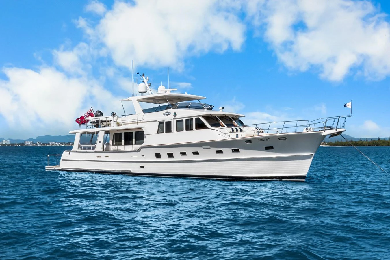 a white yacht on the water aboard ENCORE Yacht for Sale