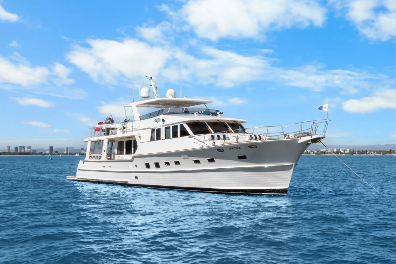 a white yacht in the water aboard ENCORE Yacht for Sale