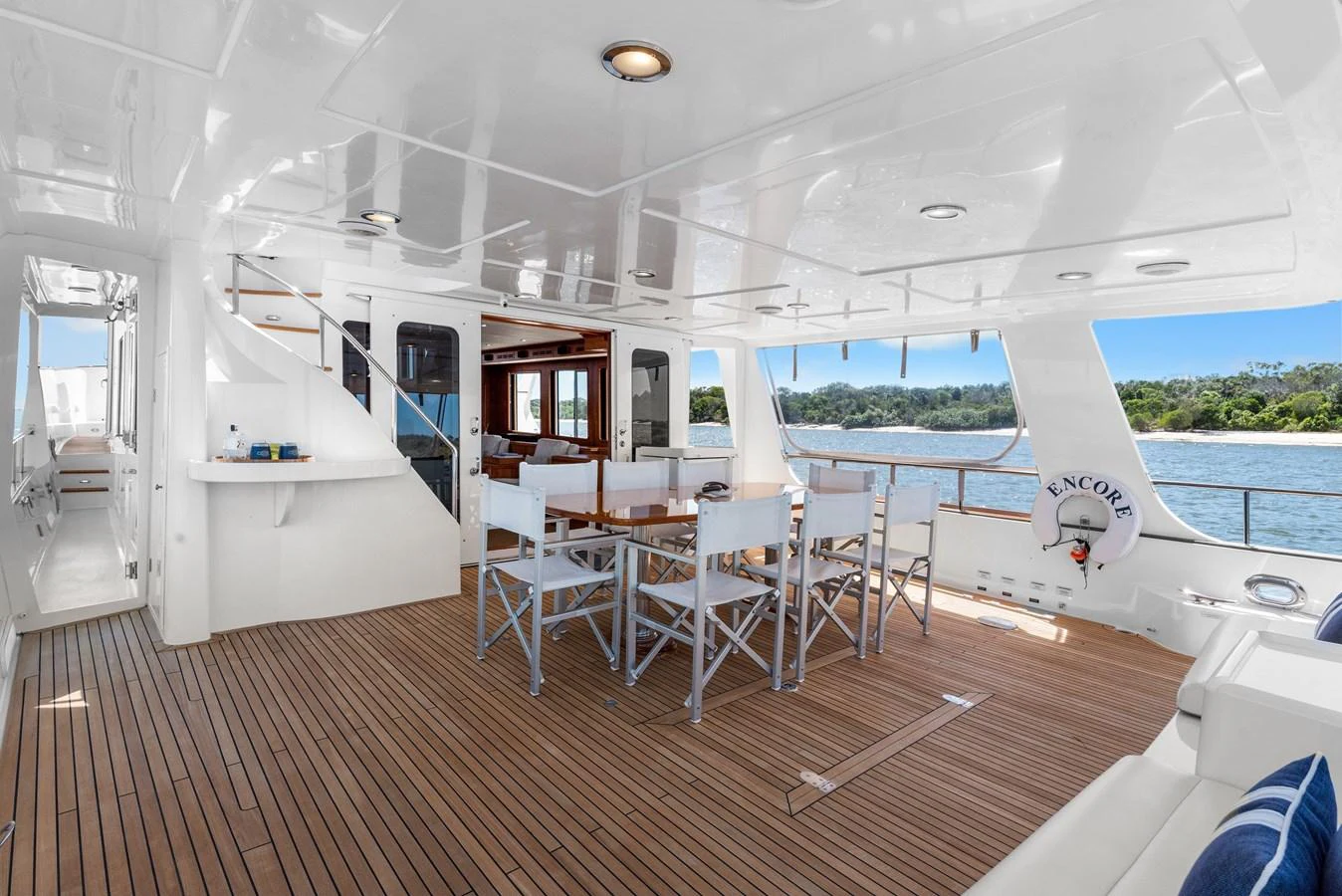 a room with a table and chairs aboard ENCORE Yacht for Sale