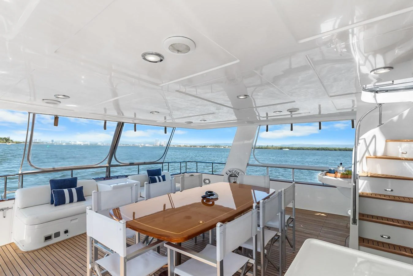 a room with a table and chairs aboard ENCORE Yacht for Sale