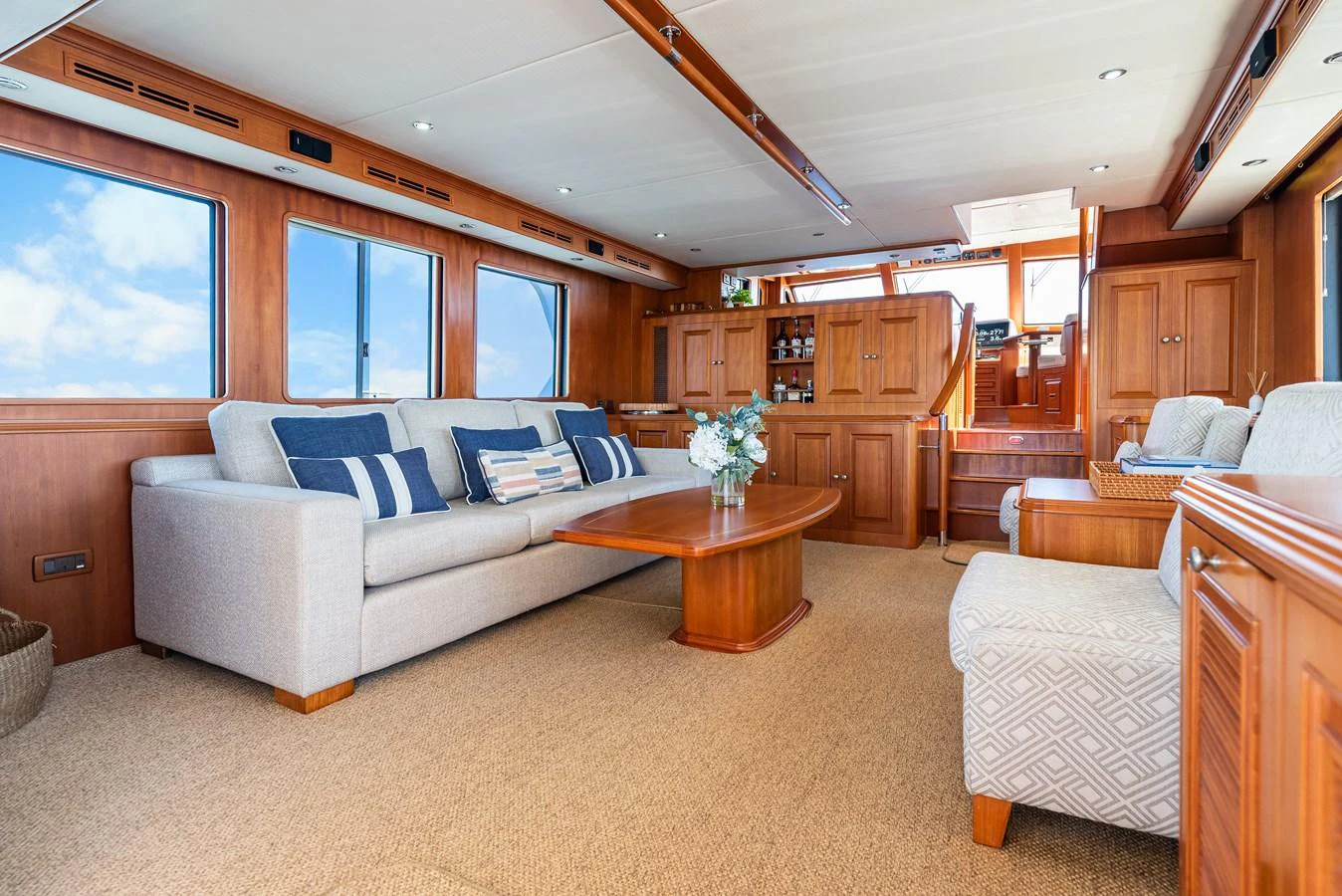 a living room with a couch and a table aboard ENCORE Yacht for Sale