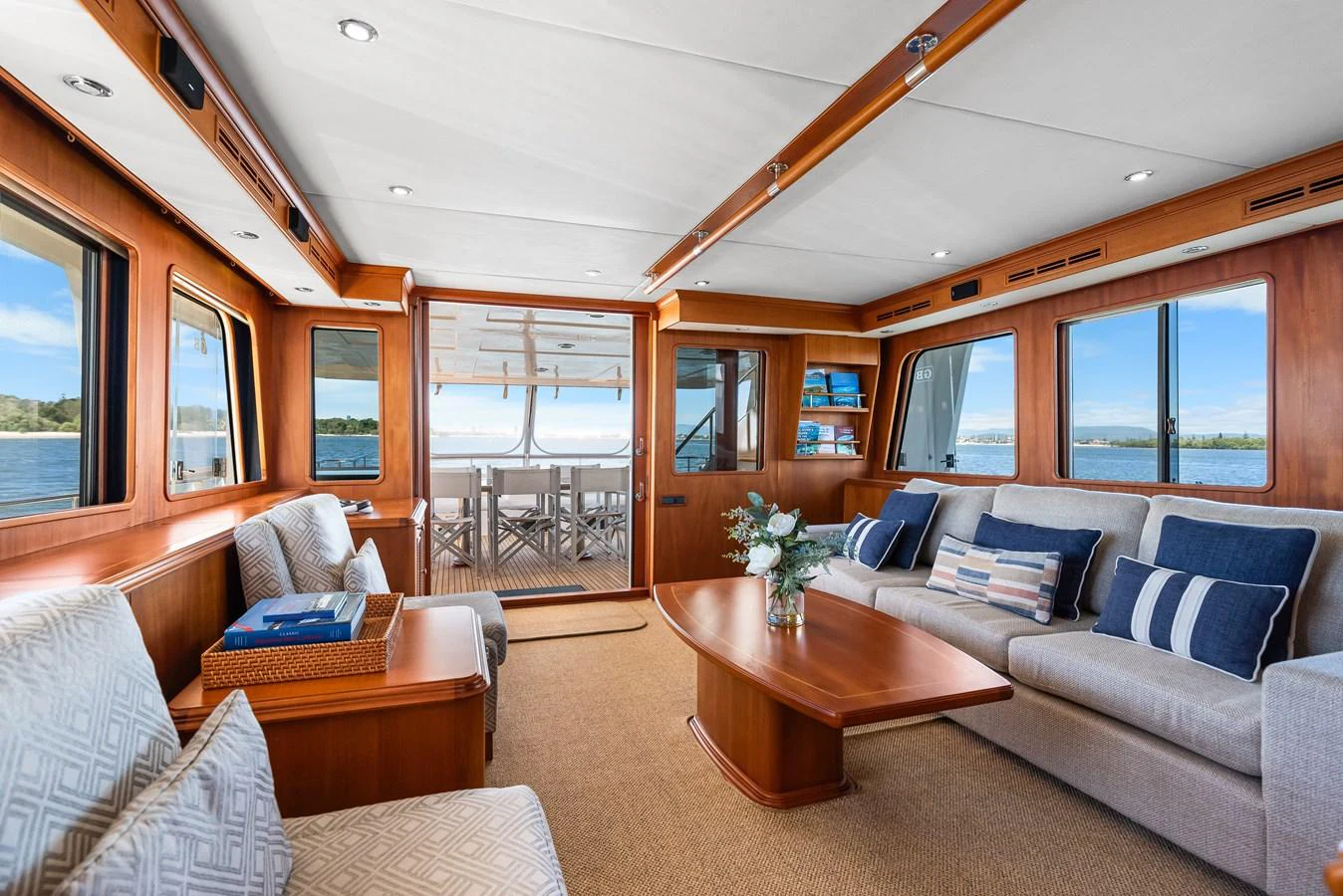 a living room with a couch and a coffee table aboard ENCORE Yacht for Sale