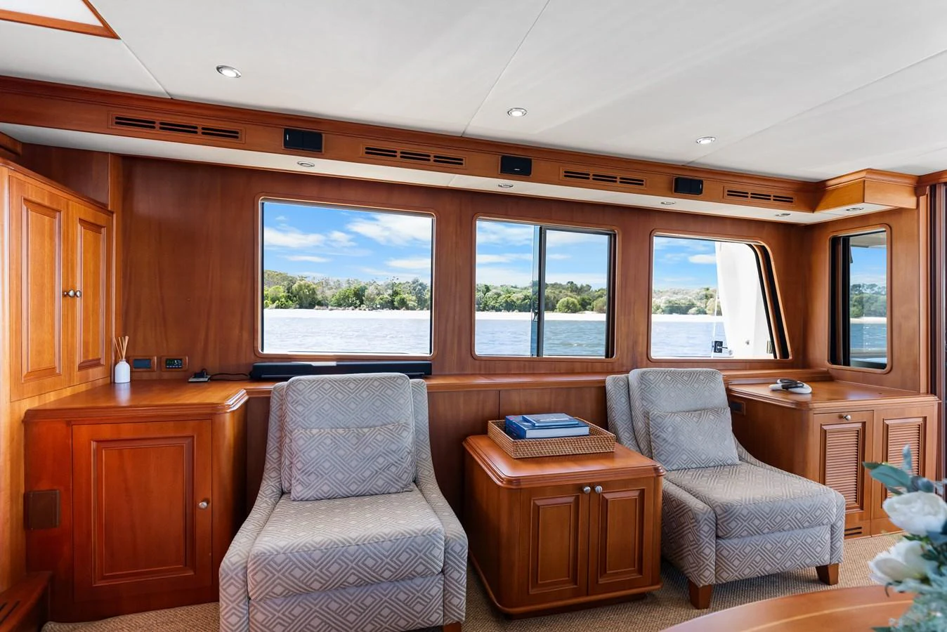 a living room with a couch and a tv aboard ENCORE Yacht for Sale