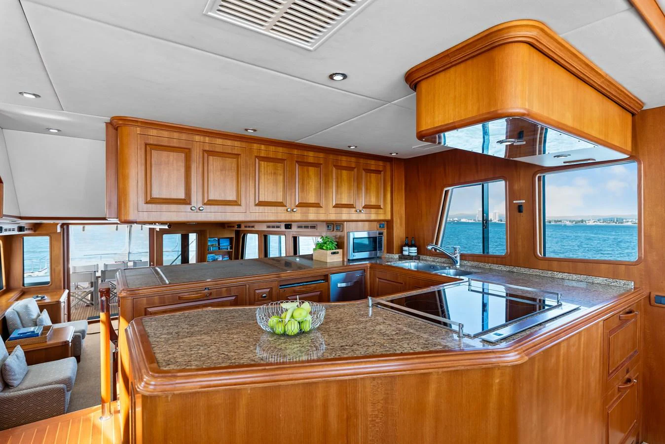 a kitchen with wooden cabinets aboard ENCORE Yacht for Sale