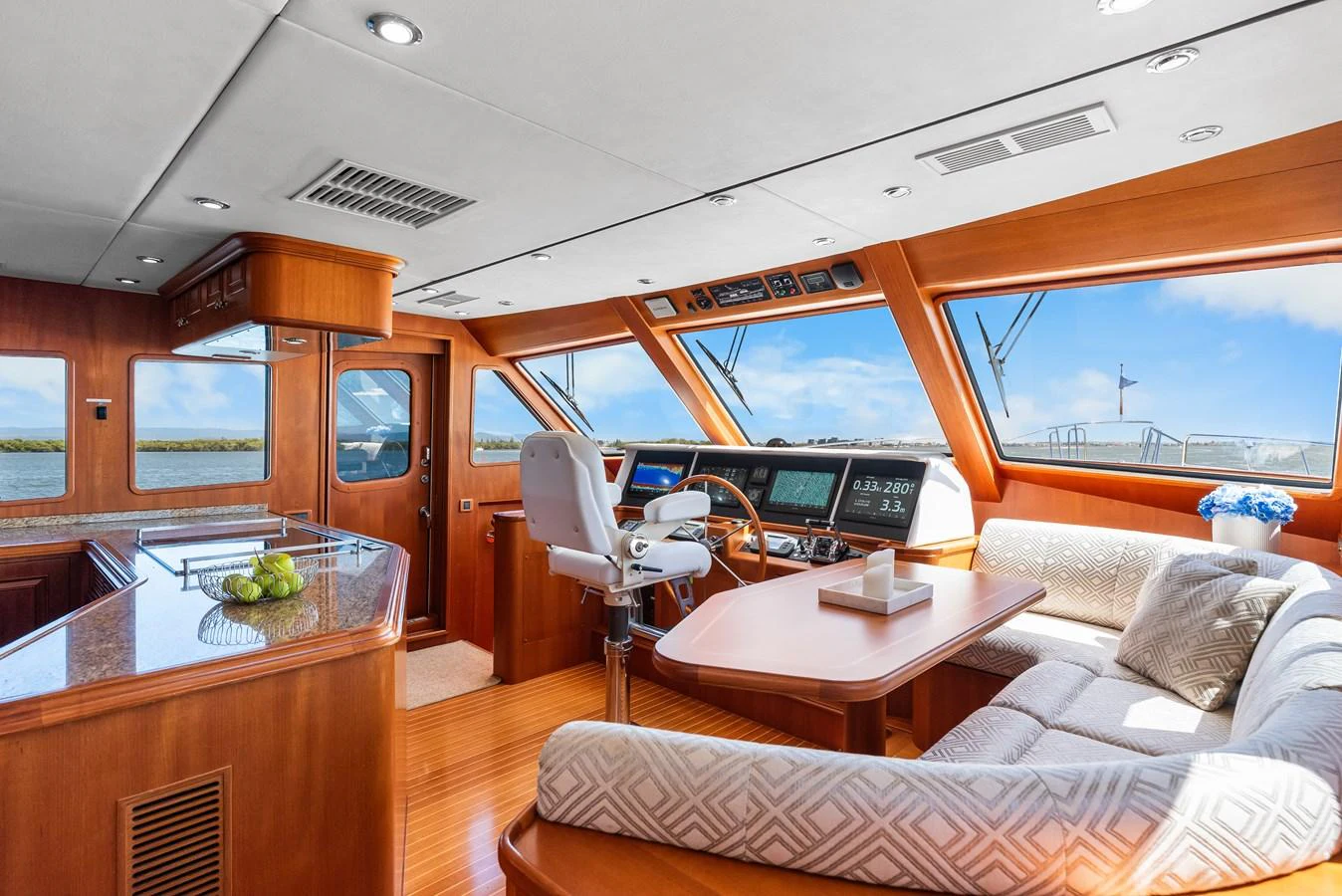a boat with a table and chairs aboard ENCORE Yacht for Sale