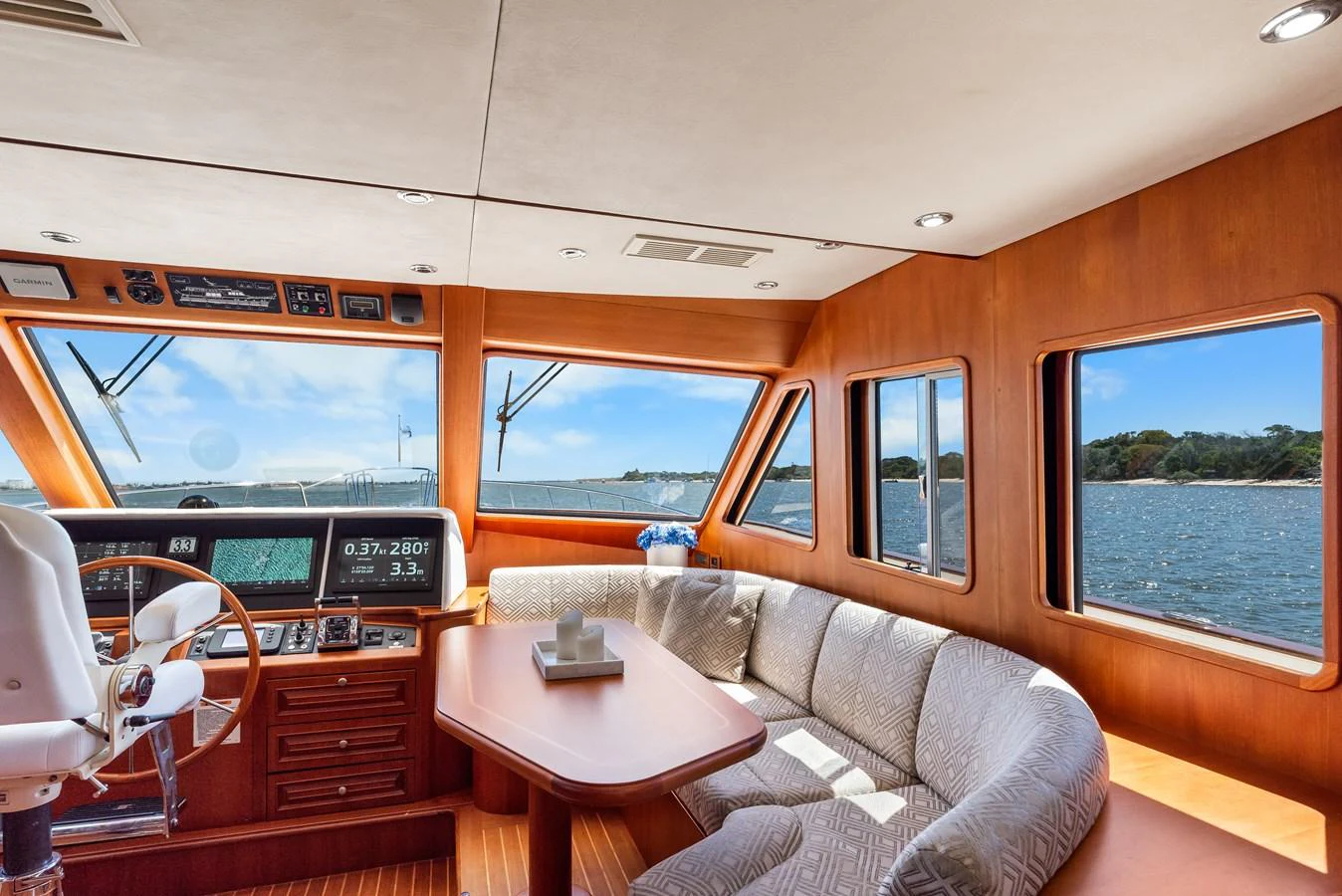 a living room with a couch and a table aboard ENCORE Yacht for Sale