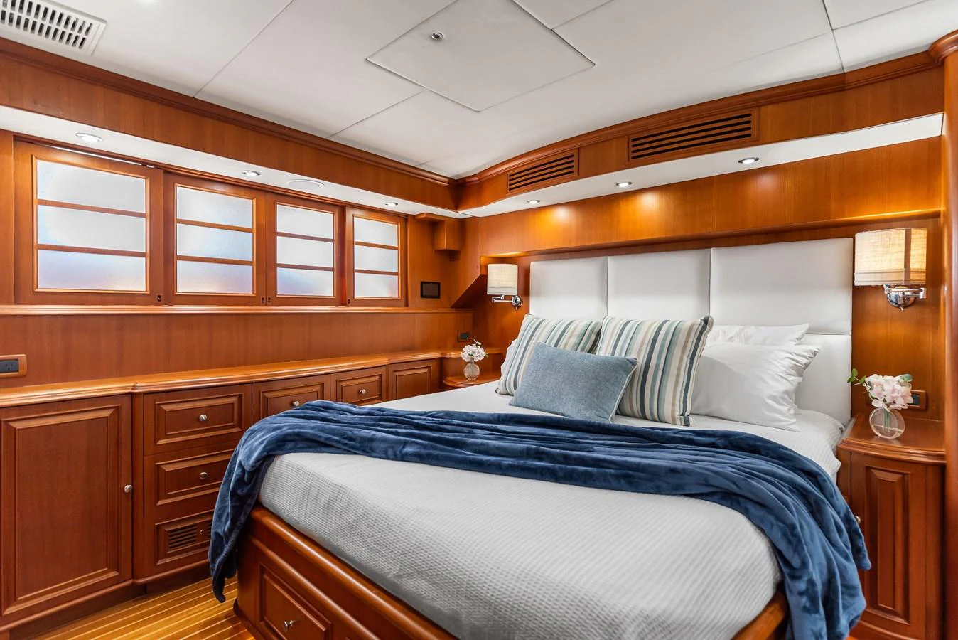 a bed with white sheets aboard ENCORE Yacht for Sale