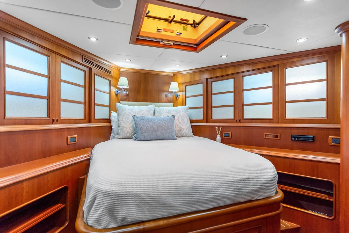 a room with a bed and a ceiling fan aboard ENCORE Yacht for Sale