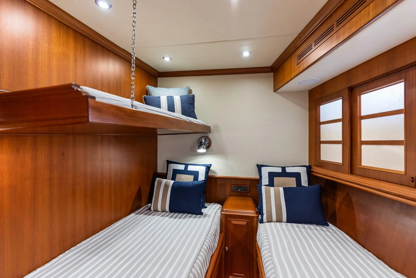a room with a bed and a chair aboard ENCORE Yacht for Sale