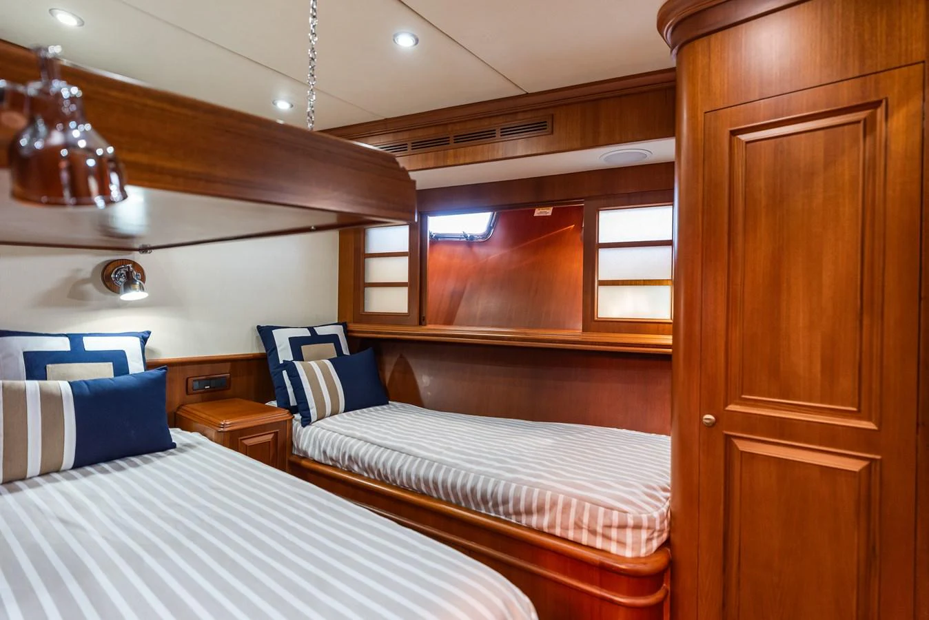 a room with two beds aboard ENCORE Yacht for Sale
