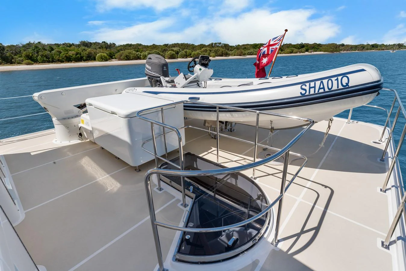 a boat with a flag on the front aboard ENCORE Yacht for Sale