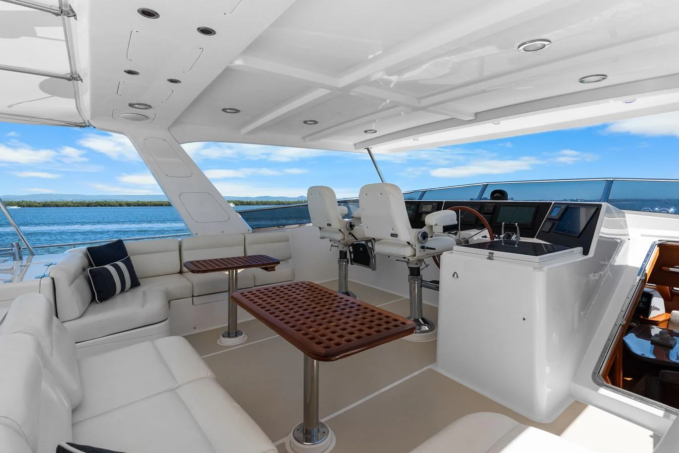a boat with a table and chairs aboard ENCORE Yacht for Sale