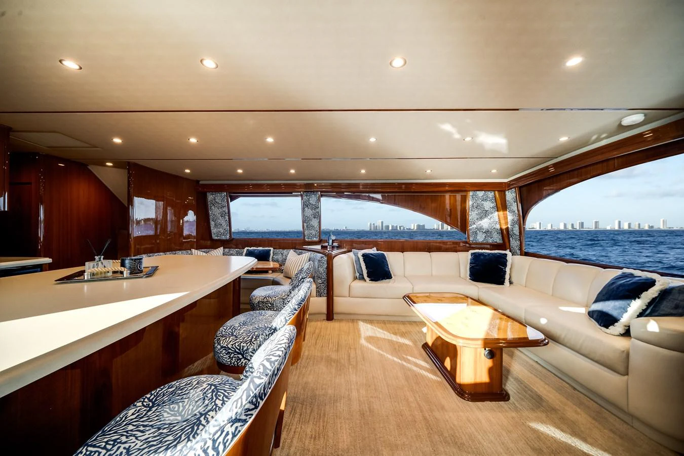 a large living room with a large window aboard EL JEFE Yacht for Sale