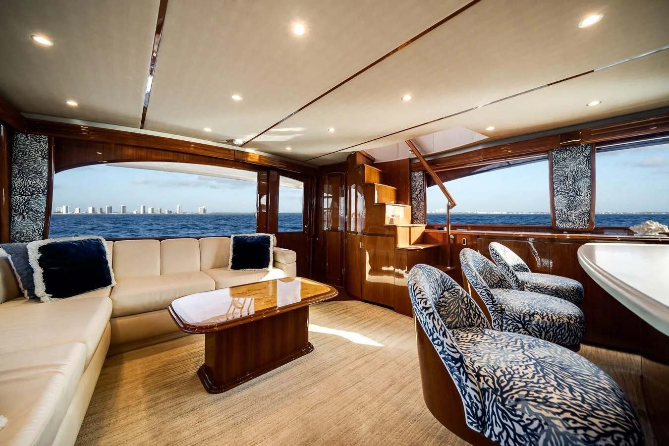 a living room with a large window aboard EL JEFE Yacht for Sale