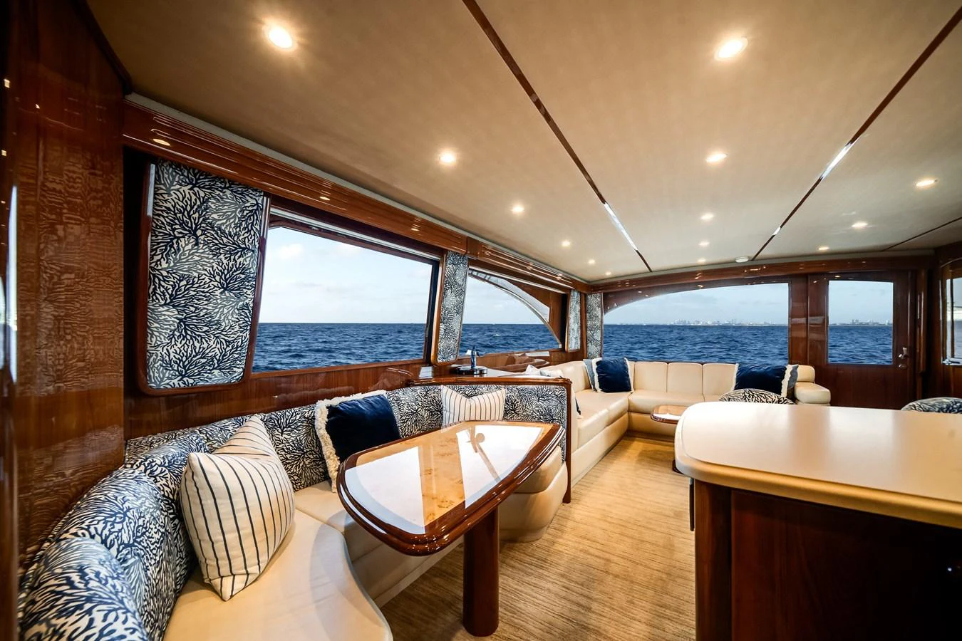 a room with a table and chairs aboard EL JEFE Yacht for Sale