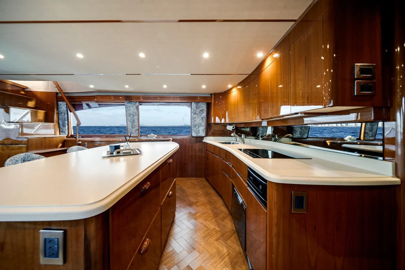 a kitchen with wooden cabinets aboard EL JEFE Yacht for Sale