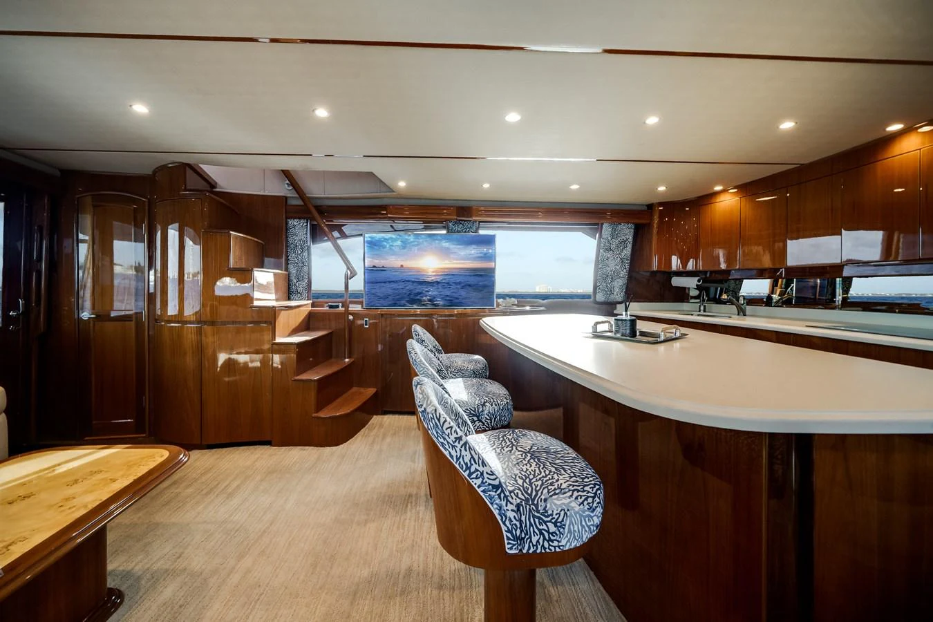 a room with a chair and a table and a large window aboard EL JEFE Yacht for Sale