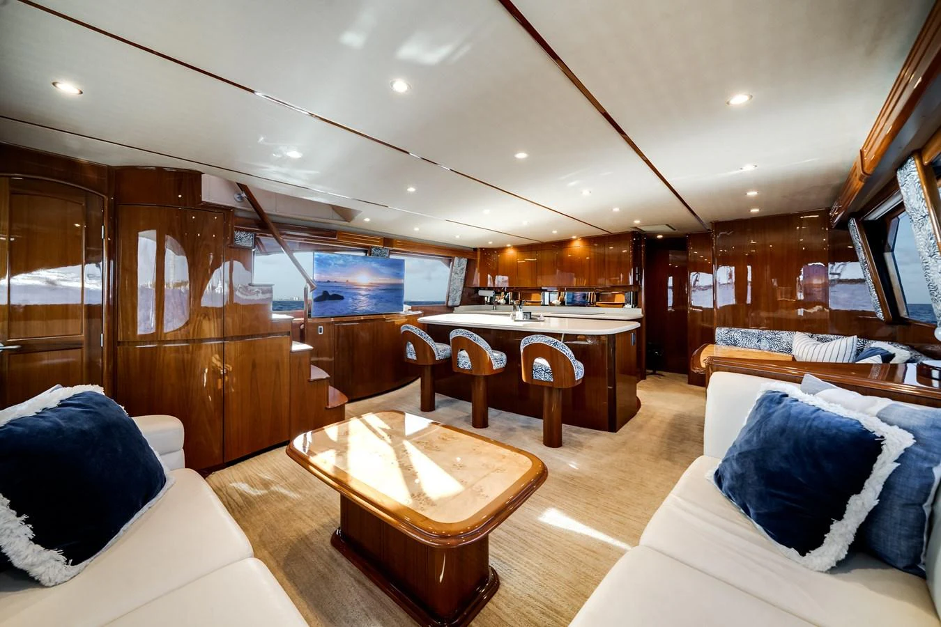 a room with a table and couch aboard EL JEFE Yacht for Sale