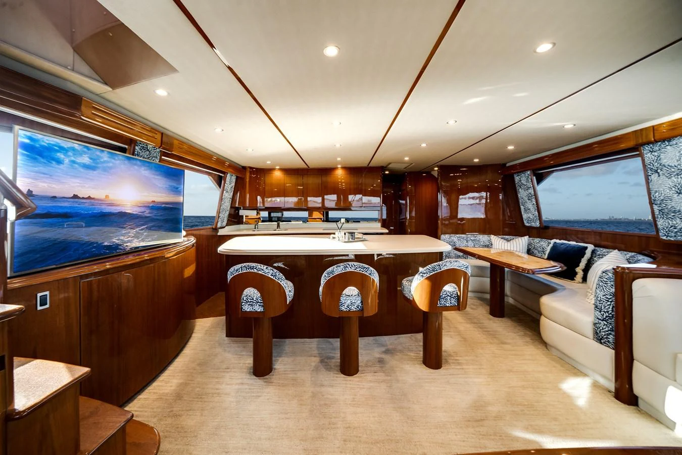 a room with a table and couches aboard EL JEFE Yacht for Sale