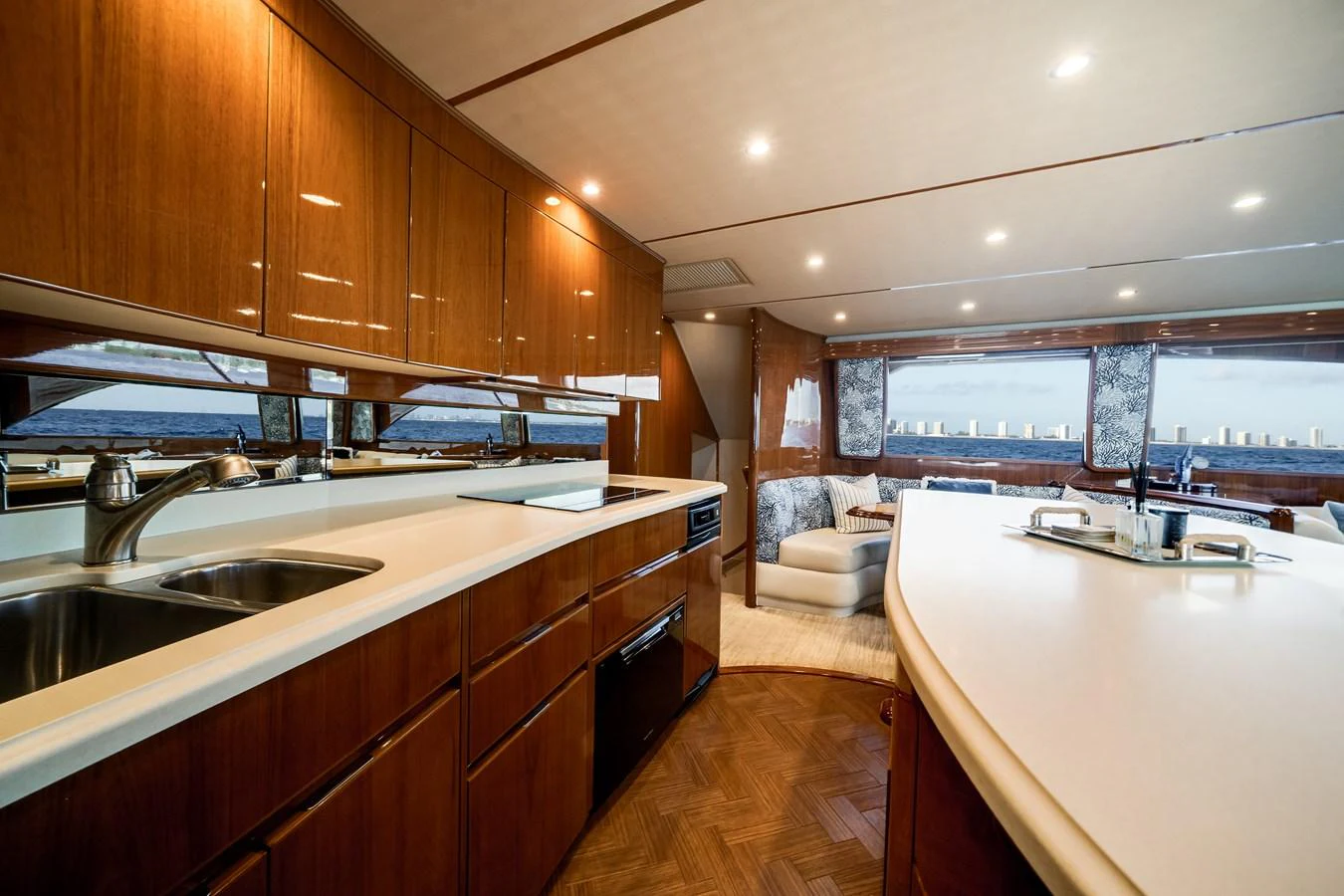 a kitchen with wooden cabinets aboard EL JEFE Yacht for Sale